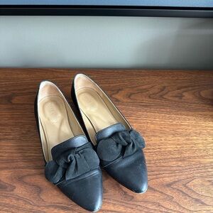 Black leather and suede bow slip ons
